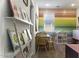 Charming playroom featuring vibrant decor, a rainbow accent wall, and cozy carpeting at 281 S San Gregorio Ln, Casa Grande, AZ 85194