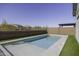 Sparkling in-ground swimming pool with artificial grass and a patio area, perfect for outdoor entertaining at 281 S San Gregorio Ln, Casa Grande, AZ 85194