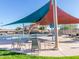 Community pool area with shade structures, tables, chairs, water slide, and play features at 281 S San Gregorio Ln, Casa Grande, AZ 85194