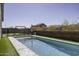 Beautiful pool with a swing set and lush surroundings at 281 S San Gregorio Ln, Casa Grande, AZ 85194