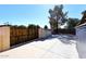 Spacious backyard featuring a metal storage shed, concrete, and a wood and metal fence at 2901 W Straford Dr, Chandler, AZ 85224