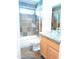 Bathroom featuring tile shower, tub, and modern vanity at 2901 W Straford Dr, Chandler, AZ 85224