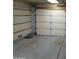Empty two car garage with concrete flooring at 2901 W Straford Dr, Chandler, AZ 85224