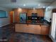 Kitchen featuring stainless steel appliances, granite countertops, and beautiful wood cabinetry at 2901 W Straford Dr, Chandler, AZ 85224