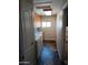 Bright laundry room with cabinets, countertop, and slate tile flooring at 2901 W Straford Dr, Chandler, AZ 85224