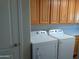 Laundry room with Whirlpool washer and dryer at 2901 W Straford Dr, Chandler, AZ 85224