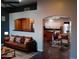 A living room area featuring a leather couch, decorated with pillows at 2901 W Straford Dr, Chandler, AZ 85224