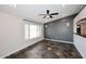 Open-concept living room with a ceiling fan and slate tile flooring throughout at 2901 W Straford Dr, Chandler, AZ 85224