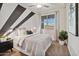 Comfortable bedroom features a neutral palette and a large window for lots of natural light at 35961 W San Ildefanso Ave, Maricopa, AZ 85138