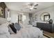 Spacious main bedroom with a large bed, contemporary decor, and ample natural light at 35961 W San Ildefanso Ave, Maricopa, AZ 85138