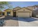 Charming single-story home featuring a two-car garage and well-maintained desert landscaping at 36307 W El Greco St, Maricopa, AZ 85138