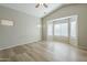 Bright main bedroom with vaulted ceiling, light wood floors, and a bay window letting in plenty of light at 36307 W El Greco St, Maricopa, AZ 85138