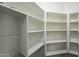 Spacious pantry with well-organized shelving, offering ample storage space at 36307 W El Greco St, Maricopa, AZ 85138