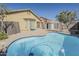 Inviting backyard oasis with a private pool, patio area, and secure fencing at 36307 W El Greco St, Maricopa, AZ 85138