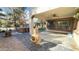 Outdoor patio features a built-in fireplace, a hot tub, and manicured lawn at 3807 E Latham Ct, Gilbert, AZ 85297