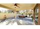 Covered patio with ceiling fan, hot tub, and desert landscaping beyond at 3807 E Latham Ct, Gilbert, AZ 85297