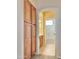 Arched doorway view into bathroom featuring storage cabinet and tile floor at 3807 E Latham Ct, Gilbert, AZ 85297