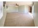 Spacious bedroom with neutral carpet and view to hallway at 3807 E Latham Ct, Gilbert, AZ 85297