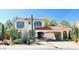 Charming two-story home featuring a terracotta roof, stucco exterior, and desert landscaping at 3807 E Latham Ct, Gilbert, AZ 85297