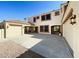 Home exterior with two-car garage and open carport at 3807 E Latham Ct, Gilbert, AZ 85297