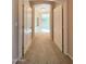 Inviting hallway with archway and neutral carpeting at 3807 E Latham Ct, Gilbert, AZ 85297