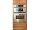 Close-up of stainless steel double ovens built into kitchen cabinetry at 3807 E Latham Ct, Gilbert, AZ 85297