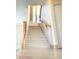 Staircase with carpeted steps, wooden railing, and glass block window detail at 3807 E Latham Ct, Gilbert, AZ 85297