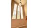 Bright foyer with decorative block windows and modern light fixture at 3807 E Latham Ct, Gilbert, AZ 85297