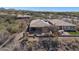 This aerial image highlights the backyard's layout, including a patio and a low-maintenance desert landscape at 41310 N Clear Crossing Ct, Anthem, AZ 85086