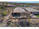 Discover this home's backyard featuring a covered patio, barbecue area, and manageable desert landscaping at 41310 N Clear Crossing Ct, Anthem, AZ 85086