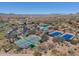 This aerial showcases the community amenities: tennis courts, pickleball and pool, promising an active lifestyle at 41310 N Clear Crossing Ct, Anthem, AZ 85086