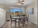 Charming dining area with picturesque window views and stylish furnishings at 41310 N Clear Crossing Ct, Anthem, AZ 85086