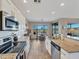 Bright kitchen with granite countertops, stainless steel appliances and breakfast nook overlooking outdoor view at 41310 N Clear Crossing Ct, Anthem, AZ 85086