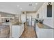 Well-appointed kitchen open to living area, featuring white cabinets and stainless steel appliances at 41310 N Clear Crossing Ct, Anthem, AZ 85086