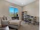 Comfortable office with large window, desk space and lounge chair perfect for working from home at 41310 N Clear Crossing Ct, Anthem, AZ 85086