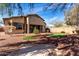 Expansive backyard featuring low-maintenance landscaping and a custom putting green at 42207 N 45Th Dr, Phoenix, AZ 85086