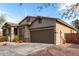 Beautiful single-story home with a desert landscaped front yard and brown trim at 42207 N 45Th Dr, Phoenix, AZ 85086
