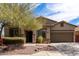 Inviting single-story house with a well-maintained front yard and attached garage at 42207 N 45Th Dr, Phoenix, AZ 85086