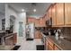 Well-equipped kitchen with stainless steel appliances, granite countertops, and plenty of cabinet space, perfect for cooking at 42207 N 45Th Dr, Phoenix, AZ 85086