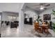 Open-concept living space with tile flooring, ceiling fan and neutral color palette at 42207 N 45Th Dr, Phoenix, AZ 85086