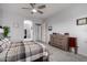 Comfortable main bedroom featuring a king bed, ample storage space, and en-suite bathroom access for added privacy at 42207 N 45Th Dr, Phoenix, AZ 85086