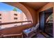 Spacious balcony featuring furniture and views of nearby building and blue skies at 4303 E Cactus Rd # 308B, Phoenix, AZ 85032