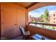 Inviting balcony view including blue skies, trees and a pool at 4303 E Cactus Rd # 308B, Phoenix, AZ 85032