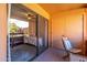 Cozy balcony featuring a chair and sliding glass doors leading into the home at 4303 E Cactus Rd # 308B, Phoenix, AZ 85032