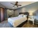 Comfortable bedroom with a plush bed, desk, and private balcony, perfect for relaxing and unwinding at 4303 E Cactus Rd # 308B, Phoenix, AZ 85032