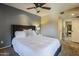 Cozy bedroom with a comfortable bed, soft lighting, and access to a private en-suite bathroom at 4303 E Cactus Rd # 308B, Phoenix, AZ 85032
