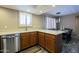 Updated kitchen with stainless steel dishwasher, wood cabinets, and lots of counter space at 4303 E Cactus Rd # 308B, Phoenix, AZ 85032