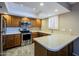 Well-maintained kitchen with stainless steel appliances and wood cabinets at 4303 E Cactus Rd # 308B, Phoenix, AZ 85032