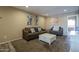 Inviting living room featuring neutral walls and cozy furniture at 4303 E Cactus Rd # 308B, Phoenix, AZ 85032