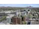 An aerial view of the building with a rooftop and city skyline featuring mountains in the background at 4808 N 24Th St # 1305, Phoenix, AZ 85016